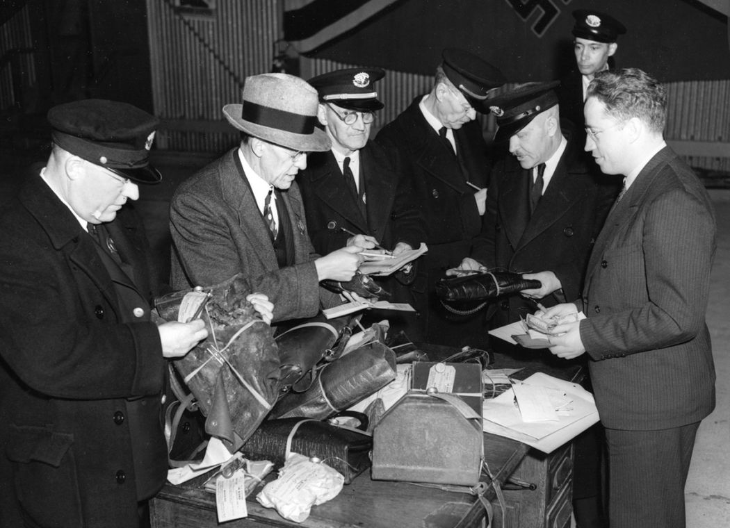 Image result for Custom officials search through baggage recovered from the Hindenburg disaster