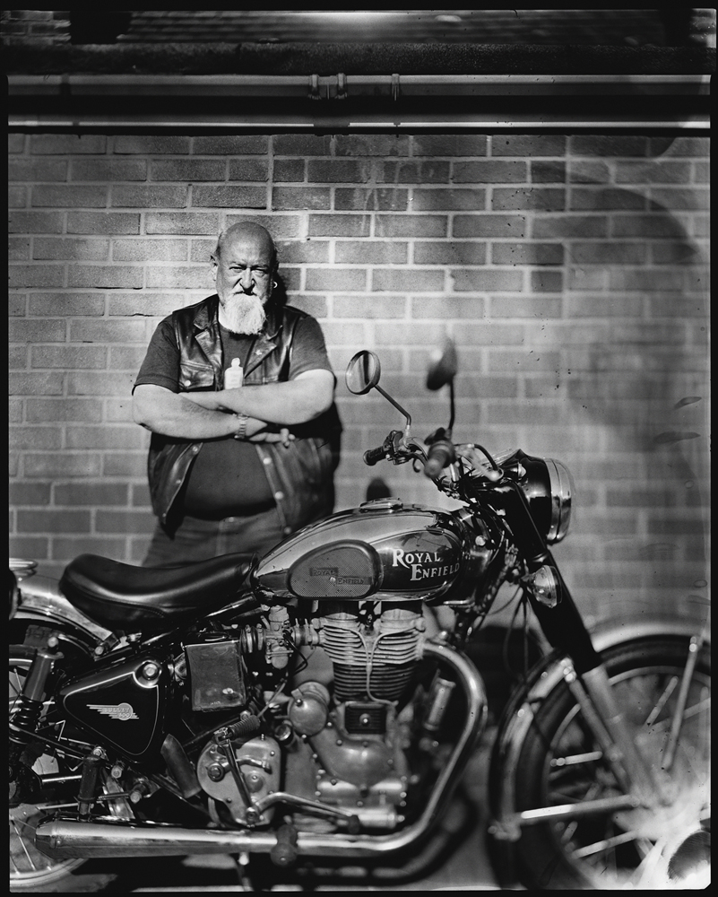 © Milosz Wozaczynski Man with his Enfield motorcycle