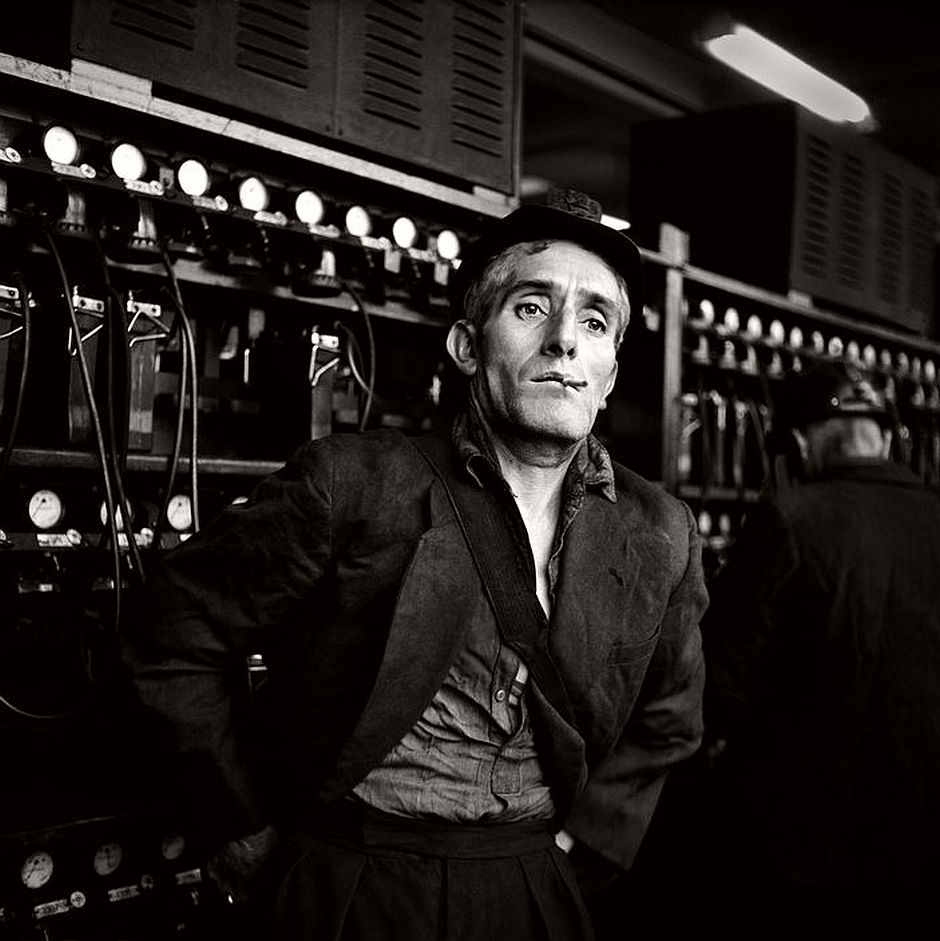 GB. Coal Miner, Wales. Miner at the Cwm colliery in South Wales. These kings of the working class sensed that their world would soon change. Miners always elicited extreme reactions from the ruling class, who saw them as enemy to be destroyed. Today they are virtually all gone - for reasons unconnected with economics. 1957.