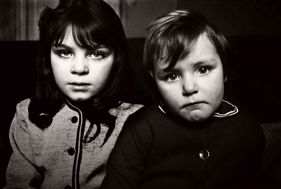 GB. ENGLAND. 1961. This brother and sister reacted to being photographed in a way that reveals the inherently different levels of self-esteem observable in children. She was alive with the solipsism of youth, while he was still uncertain.