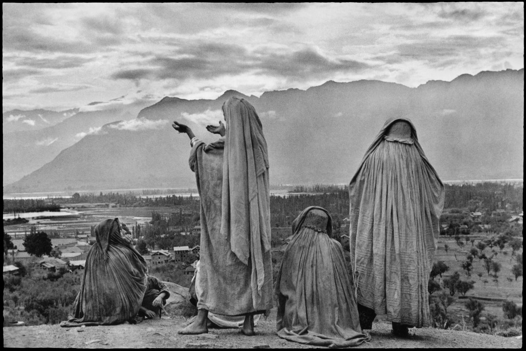 INDIA. Kashmir. Srinagar. 1948. Muslim women on the slopes of Hari Parbal Hill, praying toward the sun rising behind the Himalayas.