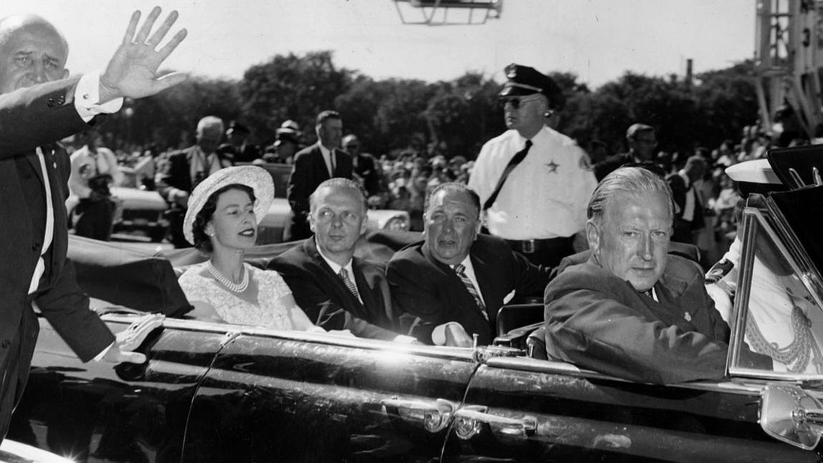 Chicago Tribune historical photo Queen Elizabeth II rides in a car with Gov. William Stratton and Mayor Richard J. Daley on July 6, 1959, in Chicago.