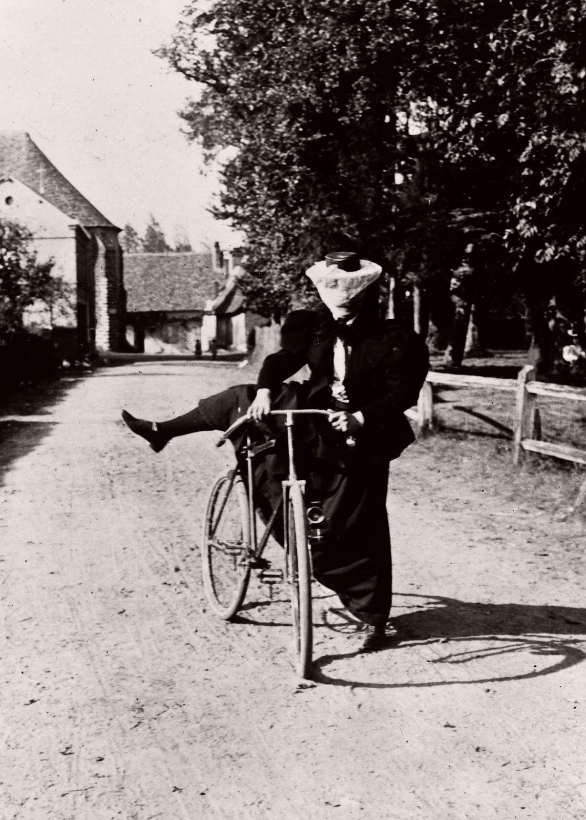 A lady mounts a safety bicycle, 1890. (Getty Images)