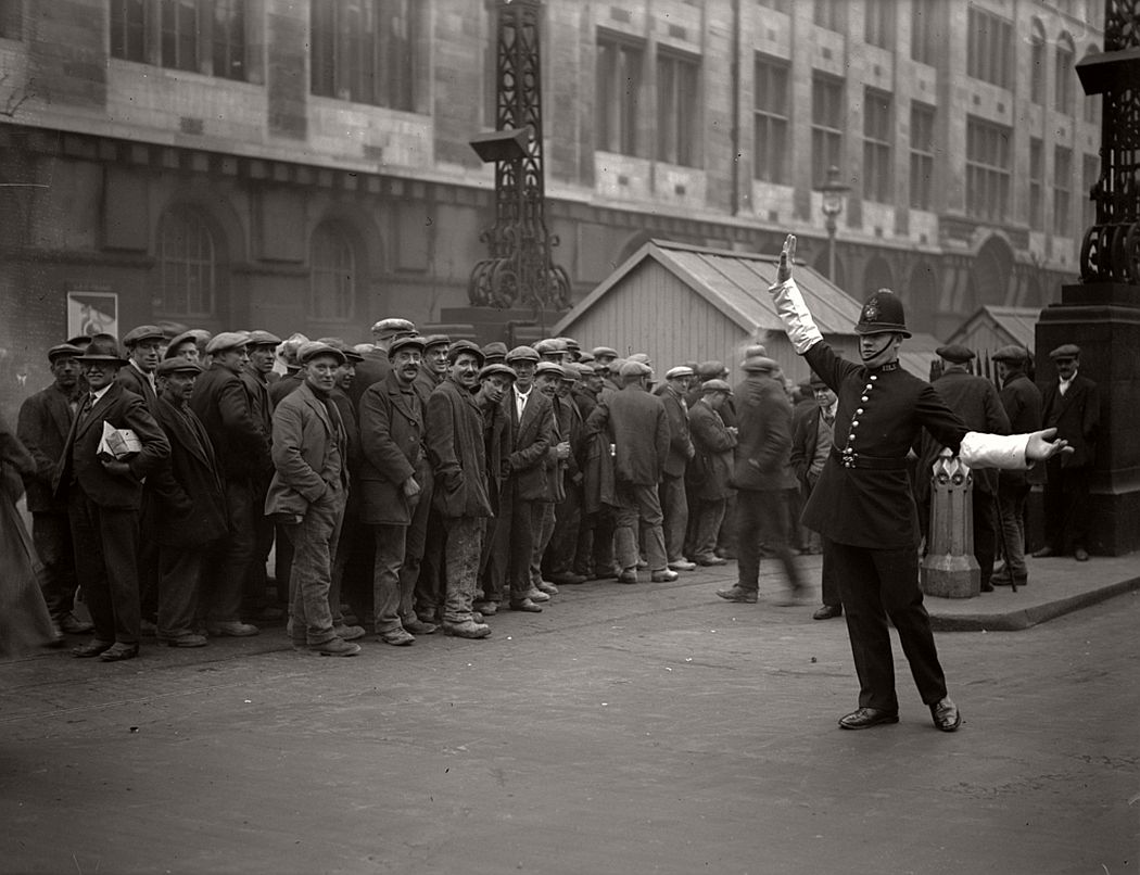 London tram workers queue up for their pay at the tram subway in Kingsway, High Holborn, 1926.