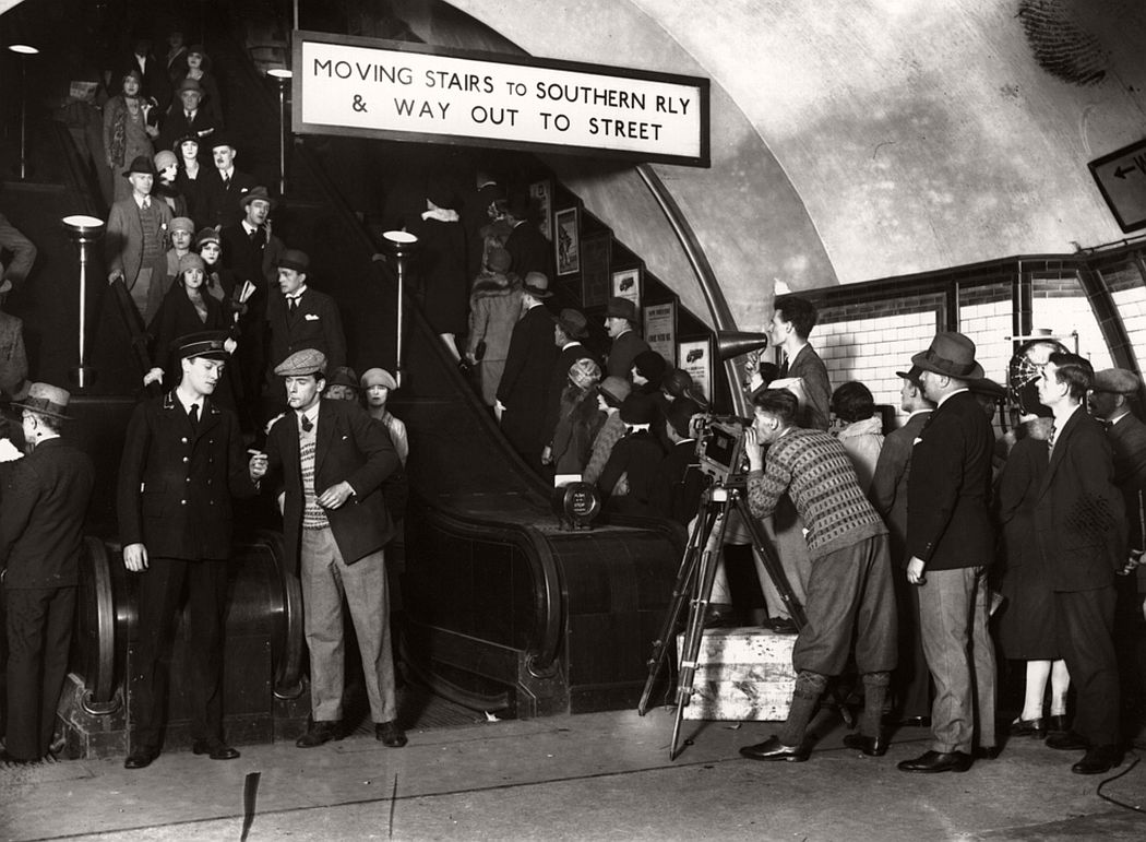 The Hon Anthony Asquith filming commuters for his film of the underground, 1928.