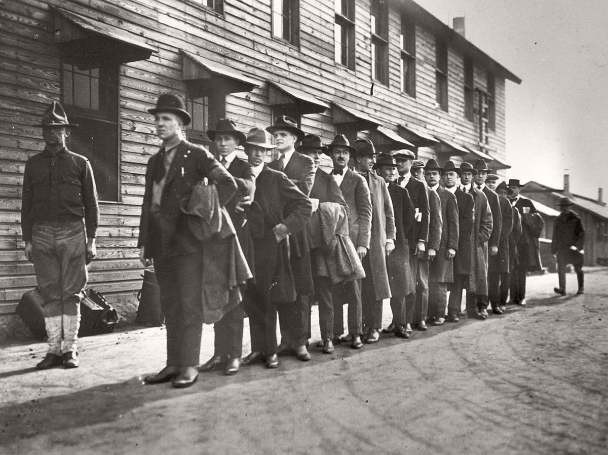   Recruits line up at a New York army camp shortly after President Woodrow Wilson declared war on Germany, in April of 1917. # AP