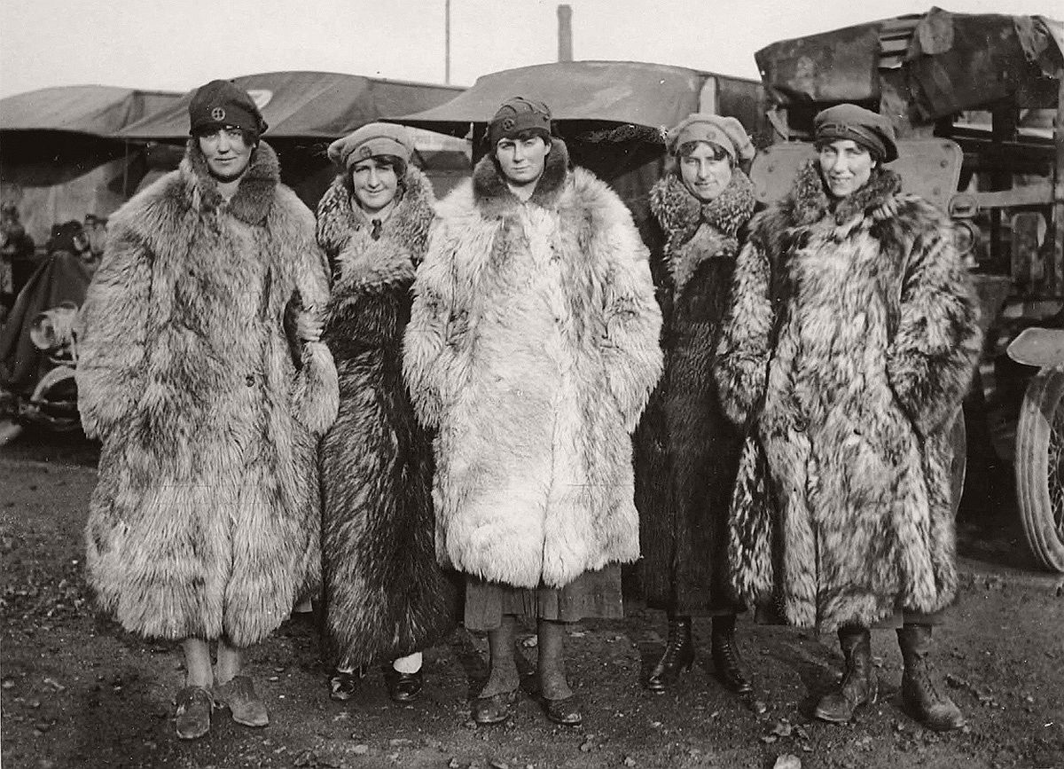   Dressed in a rather exotic uniform of army boots, army caps and fur coats, this image shows five female members of the First Aid Nursing Yeomanry standing in front of some Red Cross ambulances. As the first female recruits of this organization came from the ranks of the upper classes, perhaps the fur coats should not be too surprising. The women would have worked as drivers, nurses and cooks. Established by Lord Kitchener in 1907, the First Aid Nursing Yeomanry (FANY) was initially an auxiliary unit of women nurses on horseback, who linked the military field hospitals with the frontline troops. Serving in dangerous forward areas, by the end of the conflict First Aid Nursing Yeomanry members had been awarded 17 Military Medals, 1 Legion d'Honneur and 27 Croix de Guerre. A memorial to those women who lost their lives while working for the organization, can be found at St Paul's Church, Knightsbridge, London. # National Library of Scotland