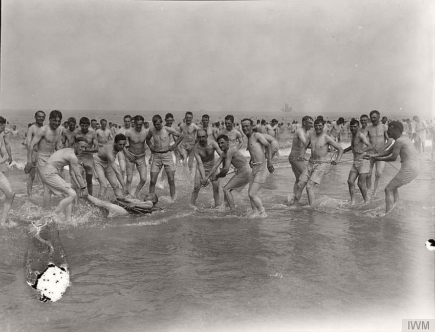 Patients from a convalescent hospital playing in the sea, France, 1918.