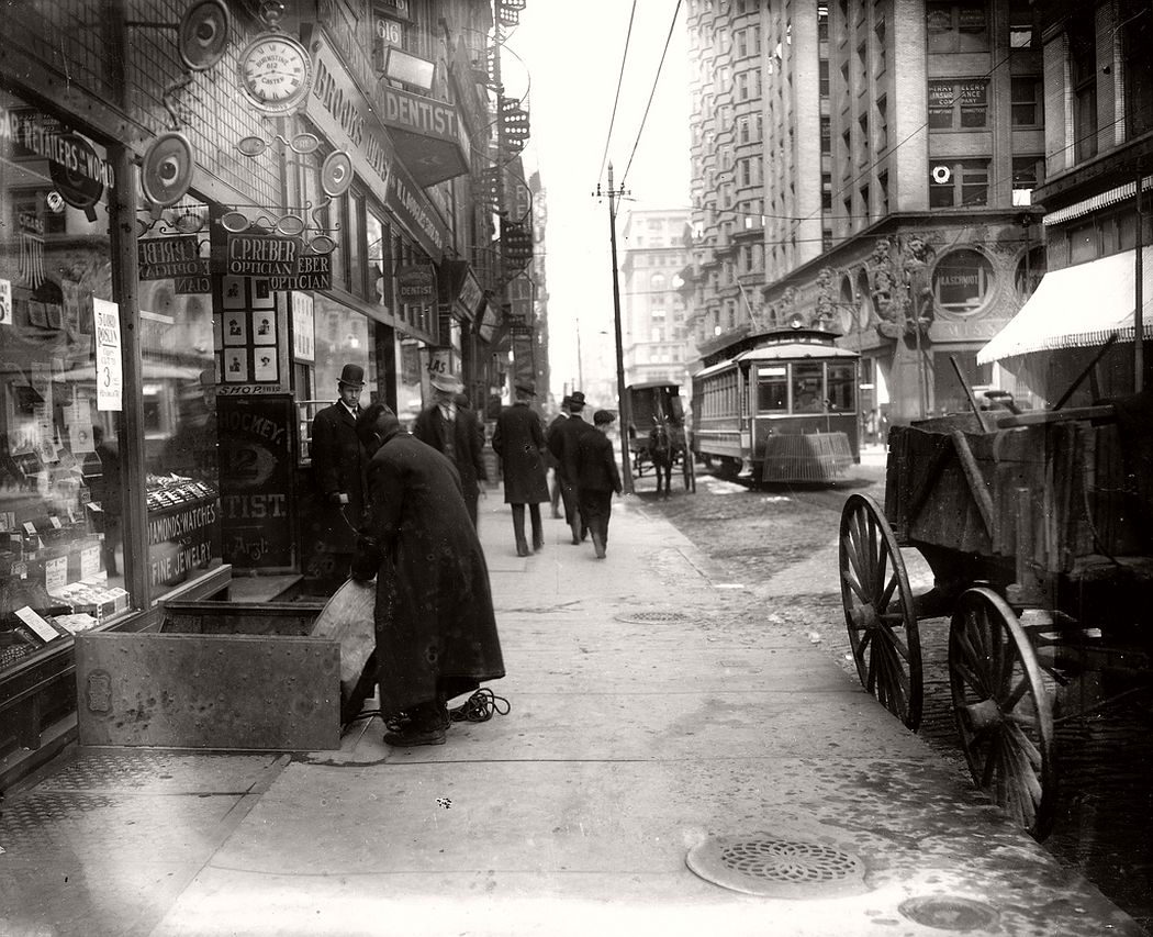 Sidewalk on Olive Street looking west from Seventh Street, ca. 1900s