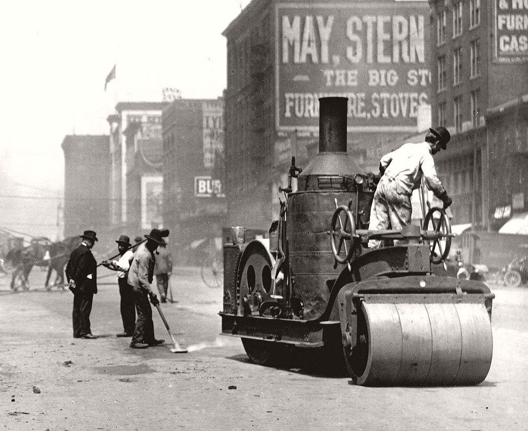 Street workers using a steam roller to repair Twelfth Street between Chestnut and Pine Streets. Photograph, 1910. 