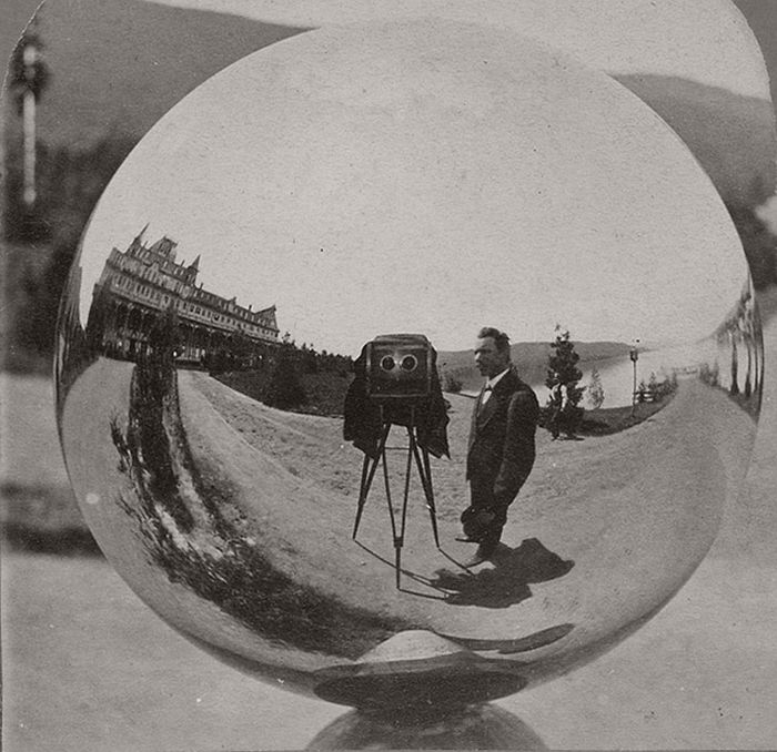 This image is half a stereo card by G.S. Irish of Glen's Falls, N.Y. The Fort William Henry Hotel, Lake George, N.Y.; the photographer; and his stereo camera are reflected in a mirrored gazing ball.