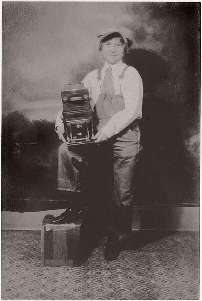 The print shows some free silver in the shadows but the appeal of the young person, a boy we thought, proudly showing off a Graflex type camera was immediate.