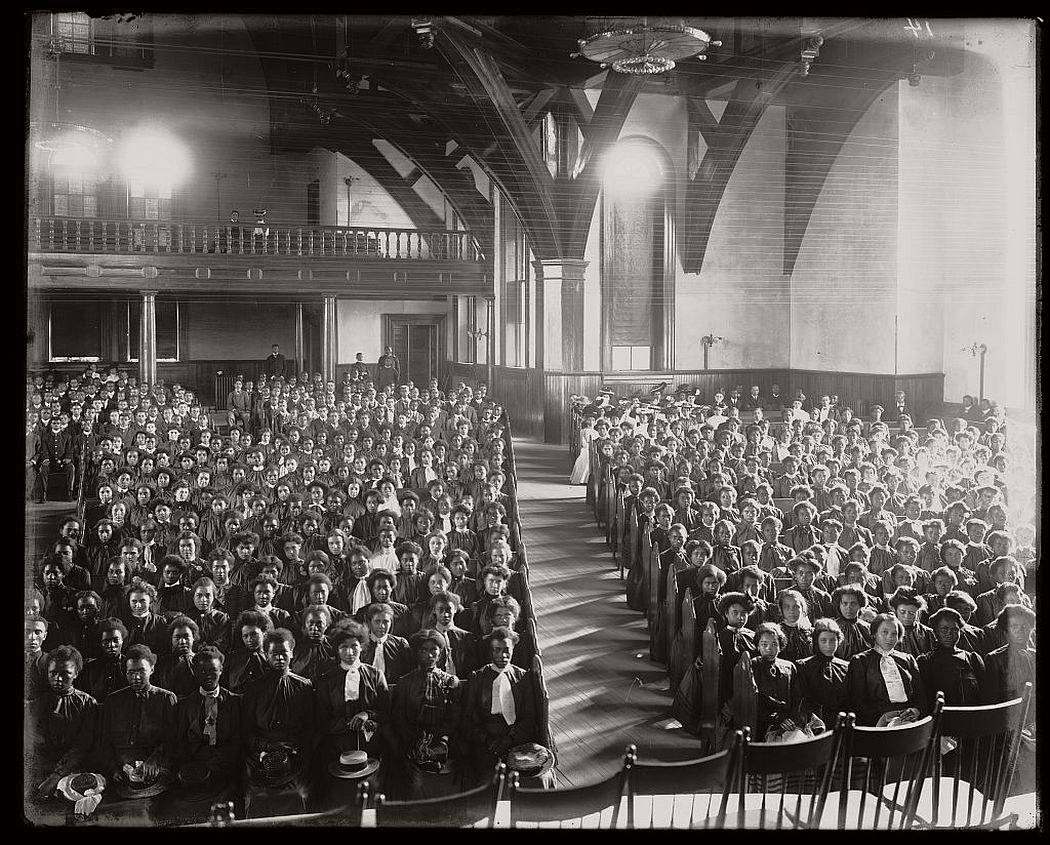Interior view of chapel filled with female students at the Tuskegee Institute, ca. 1902.