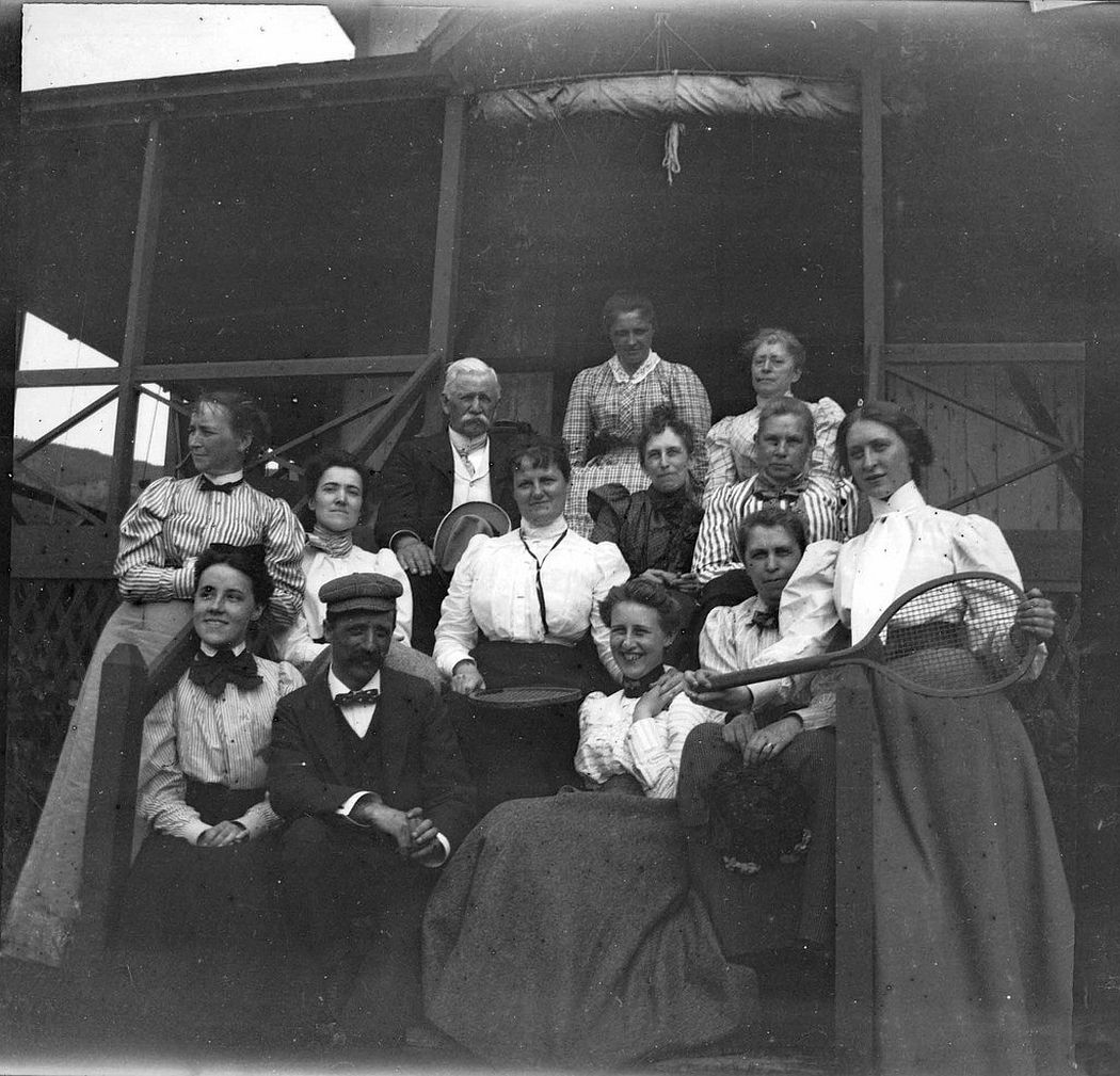 Camping crowd at Ogier Point, August 1900. Theresa's sister Grace Parker is on the right with the tennis racket, and Father Brown is seated in back with white hair.
