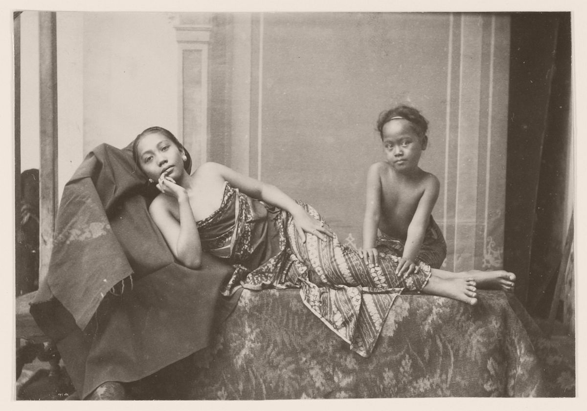 Young woman massaged by a child in Java, 1901