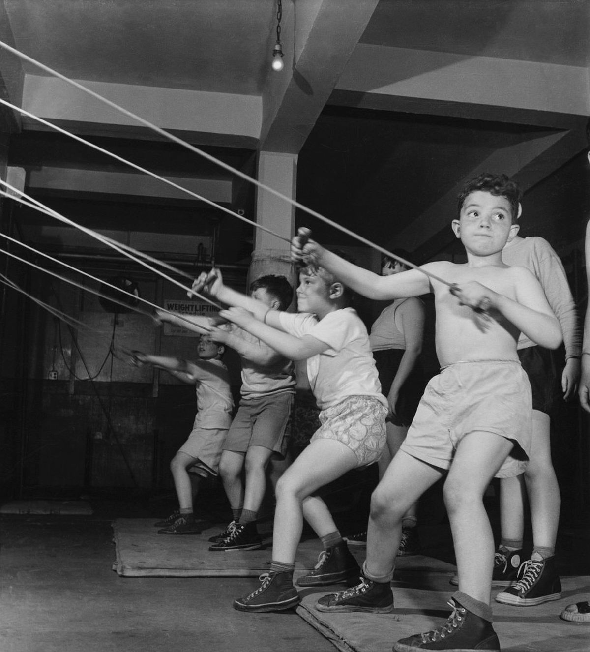 Roman Vishniac, [Boys exercising in the gymnasium of the Jewish Community House of Bensonhurst, Brooklyn], 1949. Gelatin silver print. © Mara Vishniac Kohn, courtesy International Center of Photography. 
