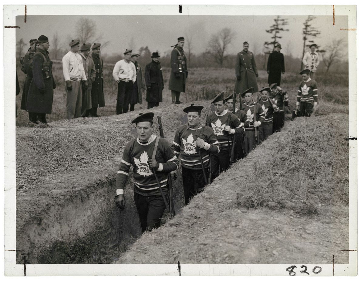 Unknown photographer for the Alexandra Studio. Distributed by the Star Newspaper Service and Times Wide World, Untitled [Members of the Toronto Maple Leaf hockey team in the trenches during a military training session], 1939, gelatin silver print. Photo courtesy of the Rudolph P. Bratty Family Collection, Ryerson Image Centre.