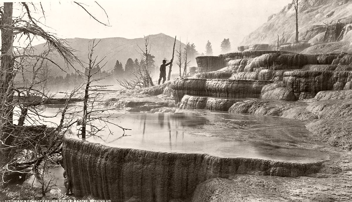 A geological surveyor explores the lower basin of Mammoth Hot Springs in Yellowstone, c.1870. (William Henry Jackson/Library of Congress/Corbis/VCG via Getty Images)