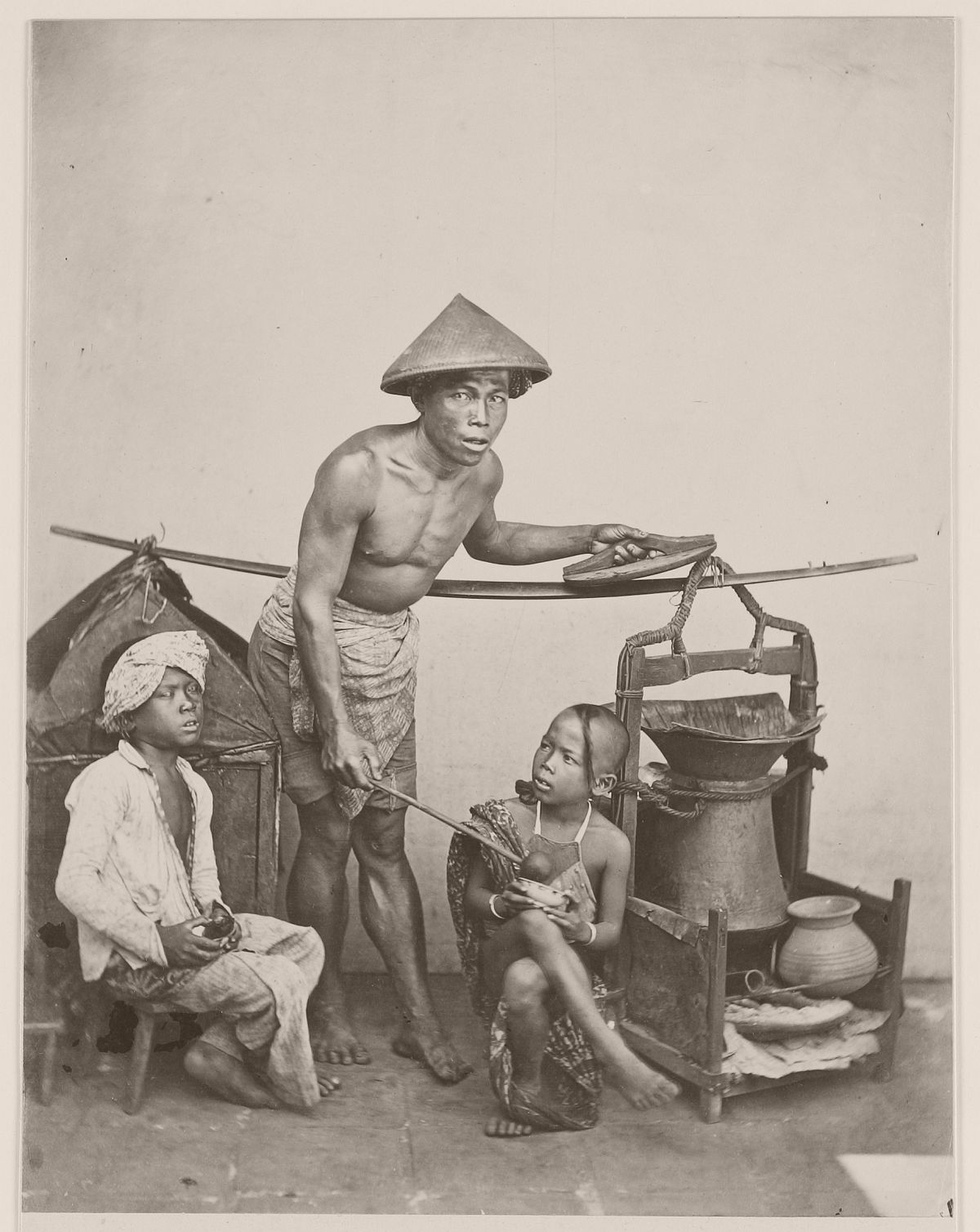 Street vendor in Batavia, circa 1870.