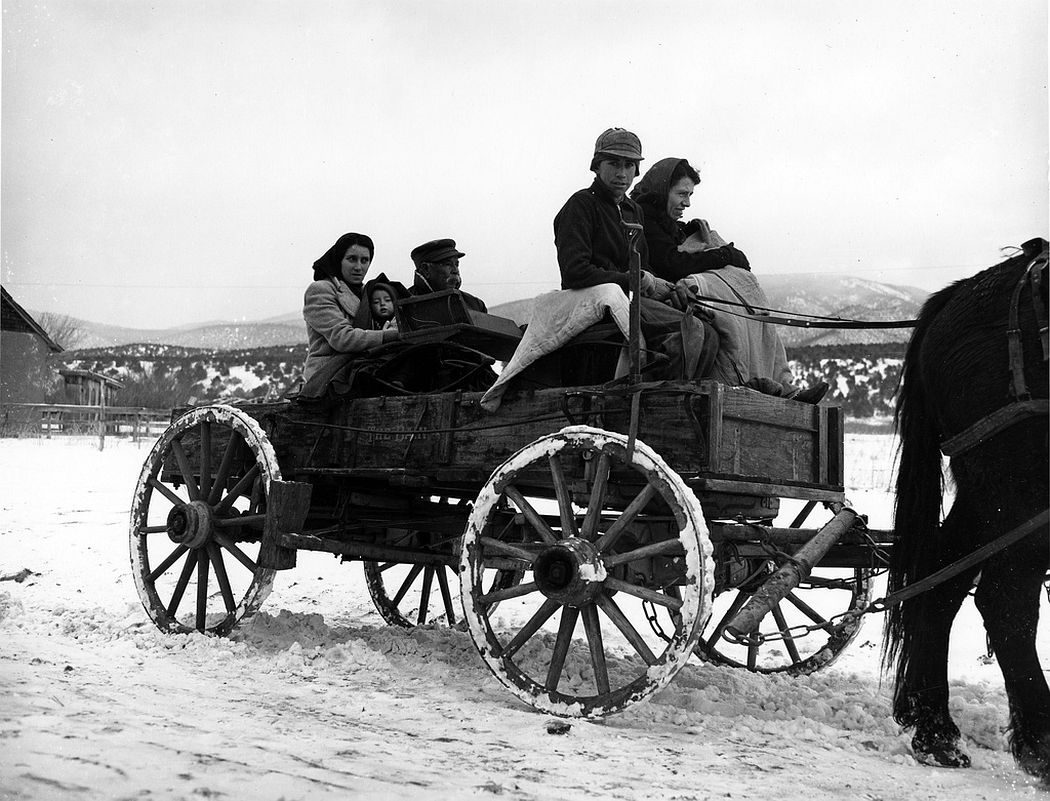 A Hispanic family in their wagon, Peñasco, New Mexico, 1943