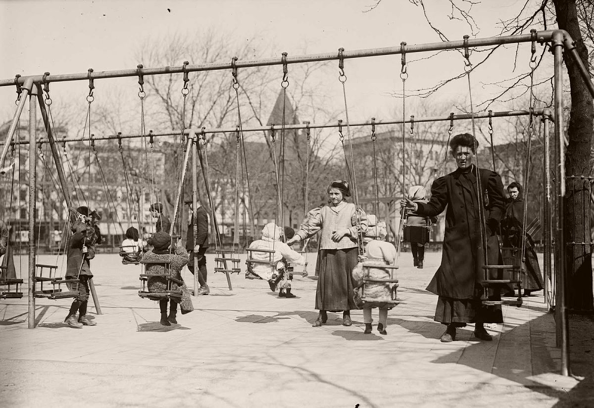 Children in swings, Hamilton Fish Park, New York.