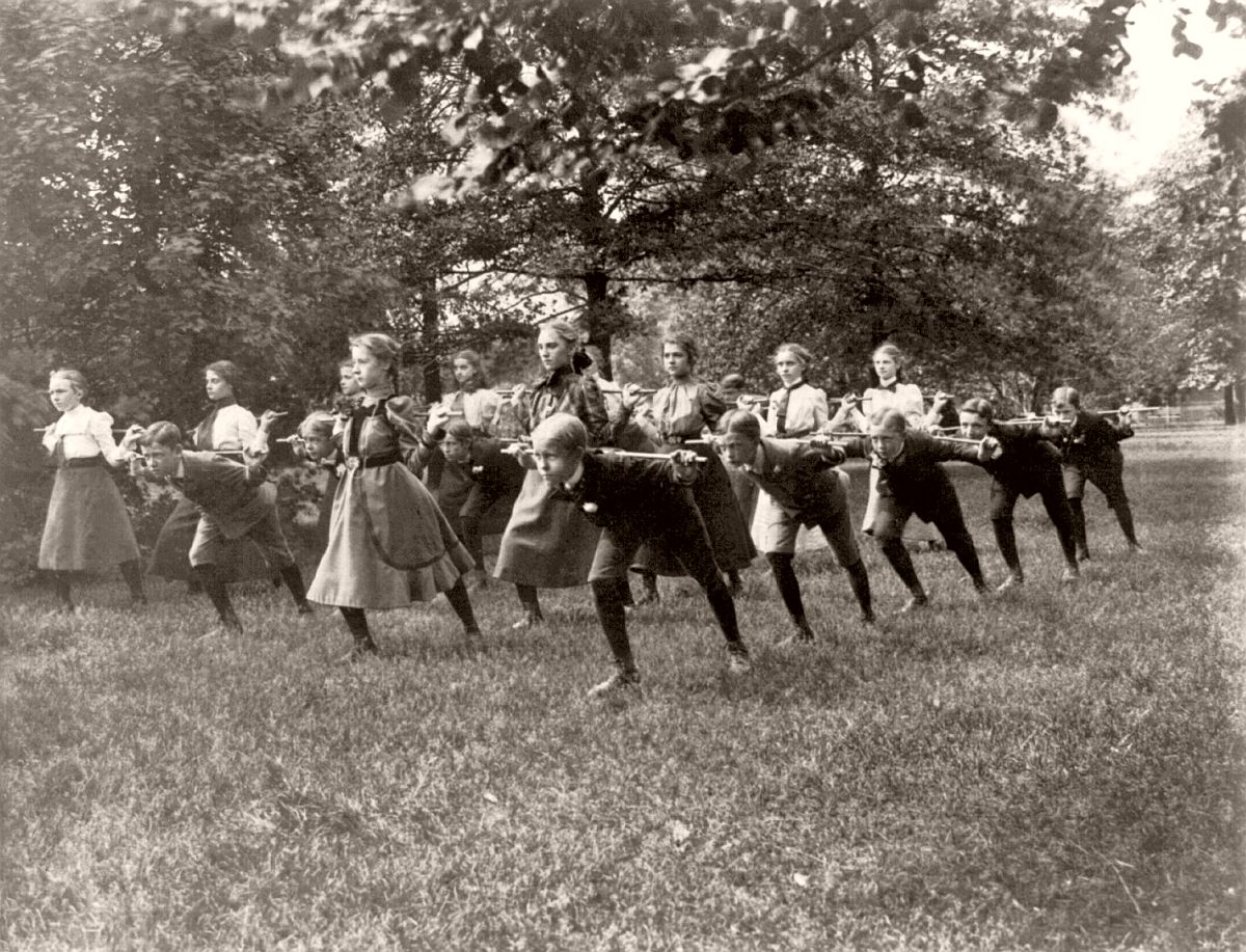 Classroom scenes in Washington, D.C. public schools - outdoor exercise with rods - 3rd Division, ca. 1899