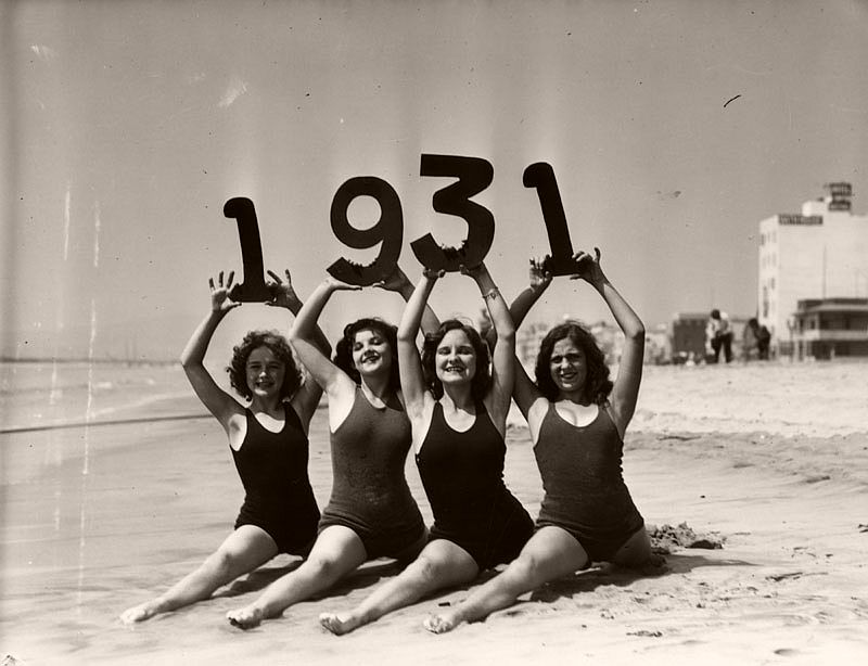 Girls on the beach in Santa Monica, California in swim suits showing the new year 1931