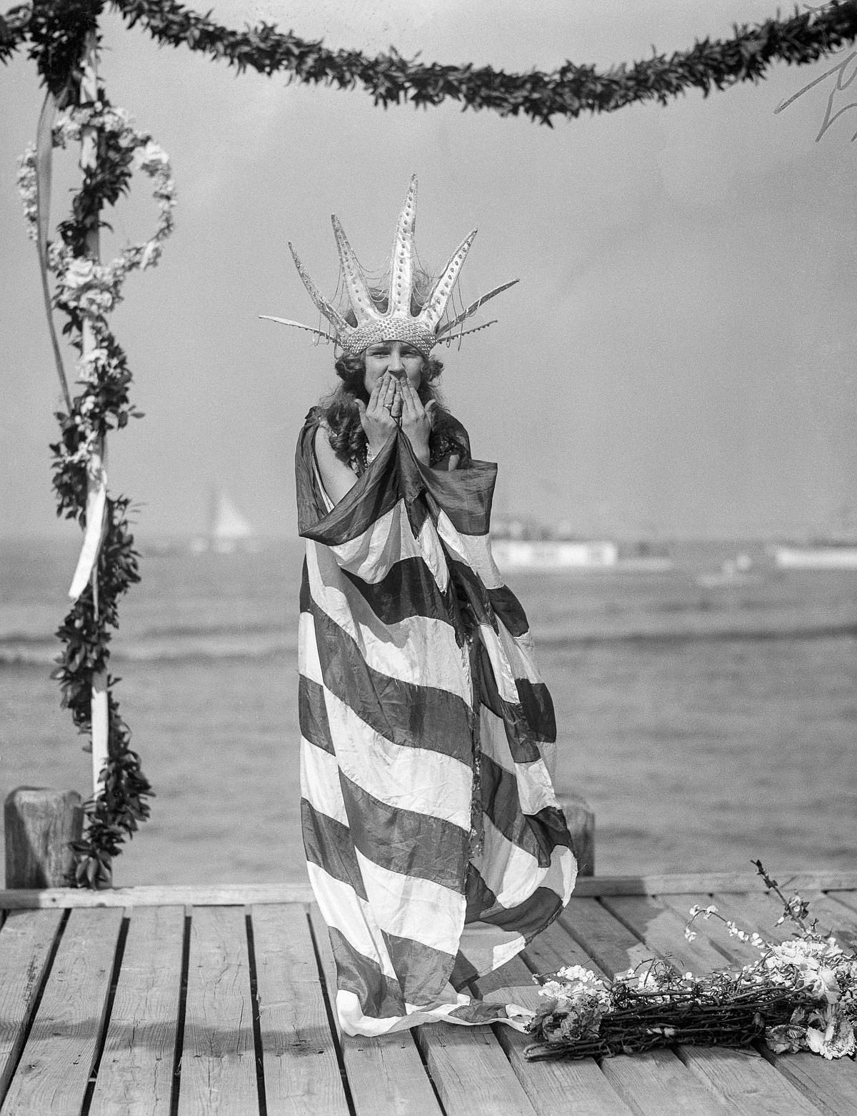 Sept. 7, 1922 - Margaret Gorman, the newly crowned Miss America, awaits the arrival of Neptune in her royal robes at the opening of the Atlantic City Beauty Pageant.
