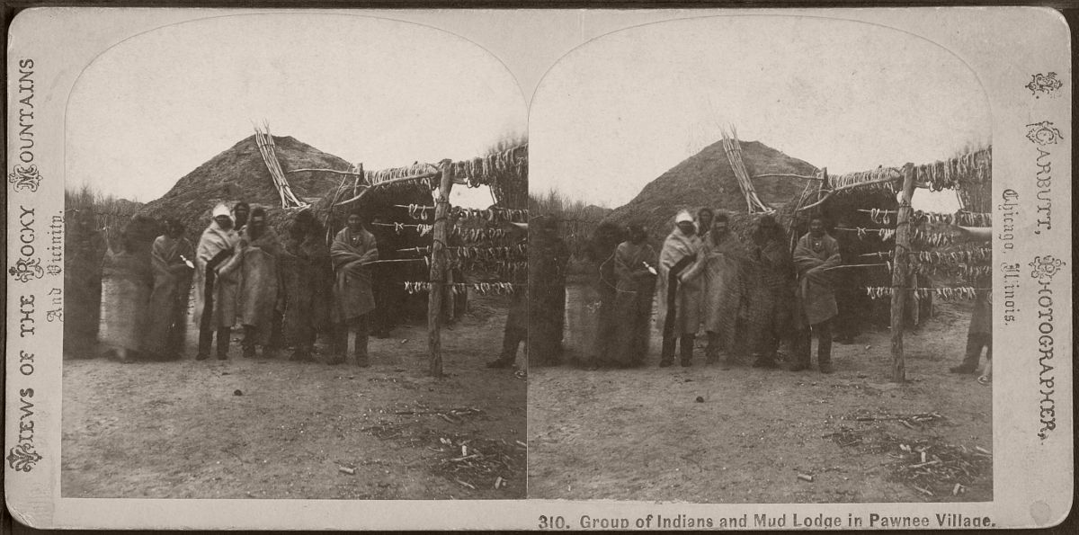 Group of Indians and mud lodge in Pawnee village, by Carbutt, John, 1832-1905