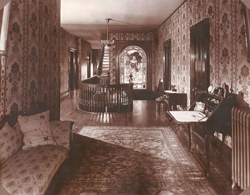 The upstairs hallway at 'Ivyhurst.' The stained glass window in the background was saved and is on display at the Waynesburg University Paul R. Stewart Museum