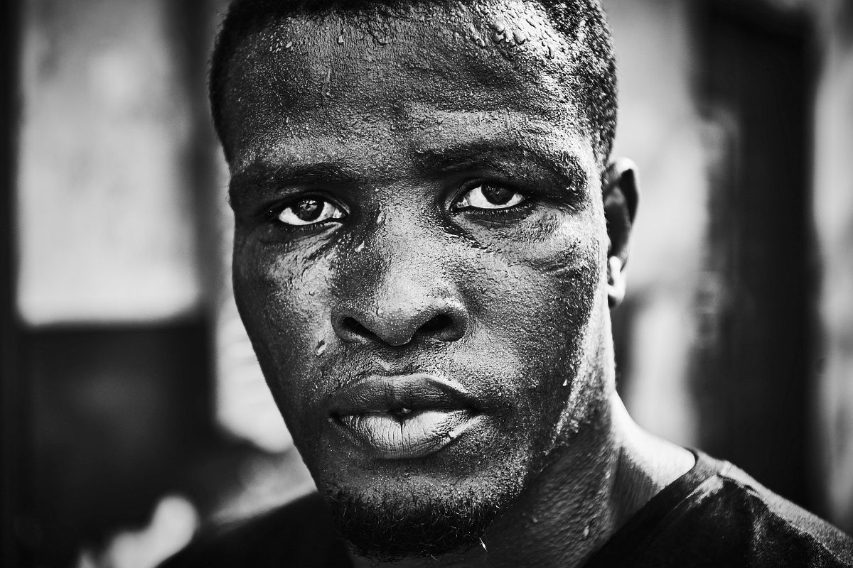 Boxer Obodai Sai poses for a portrait after a training session at "Attoh Quarshie Boxing Gym" in Accra, Ghana, on September 28th 2017.