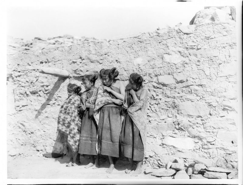 Hopi Indian girls standing in a row in the village of Oraibi