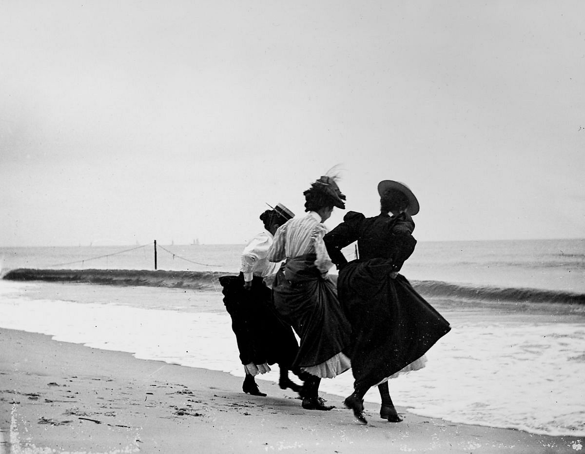 Sept. 8, 1897 - Gertrude Hubbell, Ruth Peters, and Mildred Grimwood play near the water at Arverne, Queens.