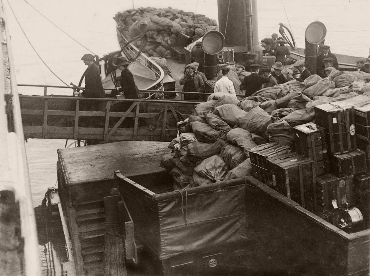 Mail bags and trunks being loaded onto the Titanic, April 11, 1912.