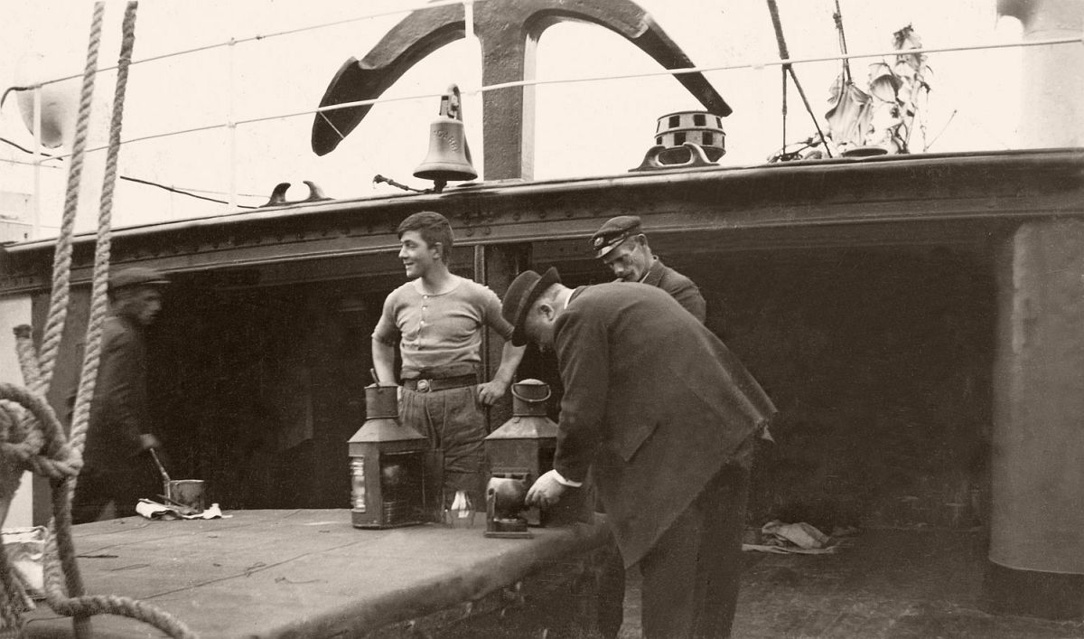 Inspection of signal lamps aboard a tender used to ferry passengers to the Titanic, 1912.