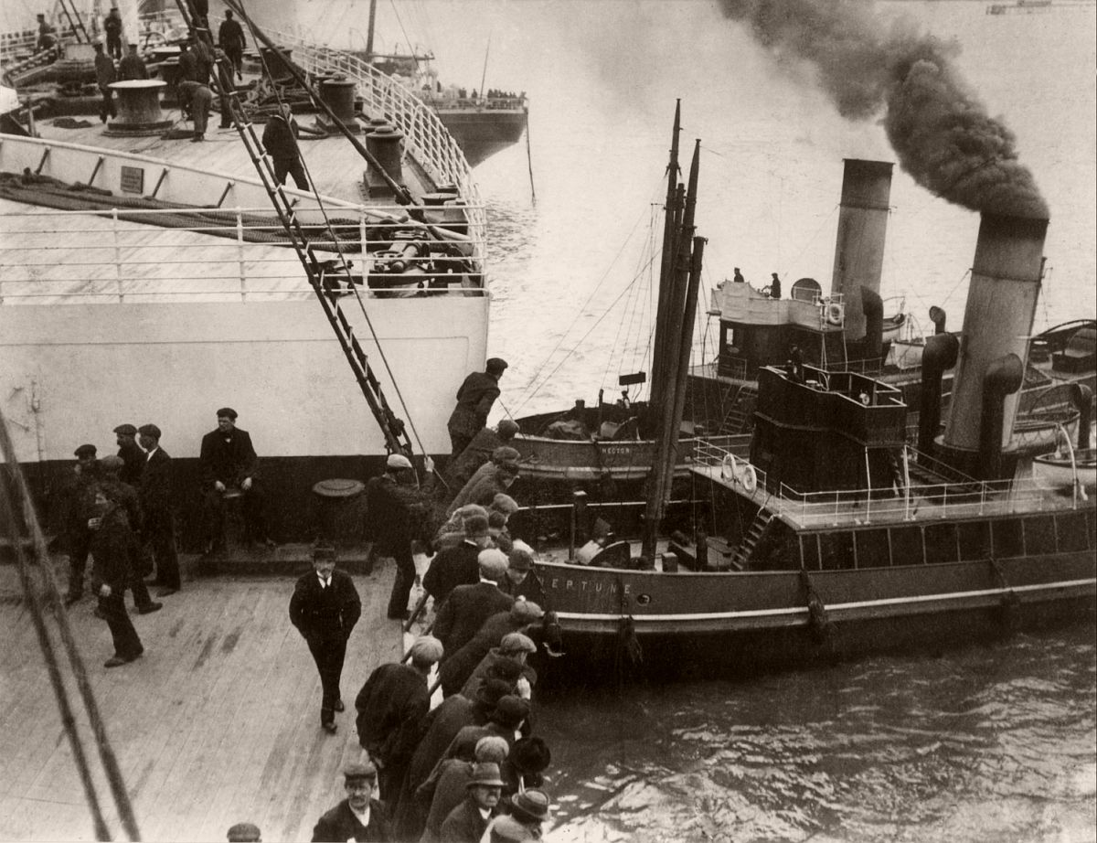 Tugs 'Hector' and 'Neptune' nudging the bow of the Titanic away from a near collision, 1912.
