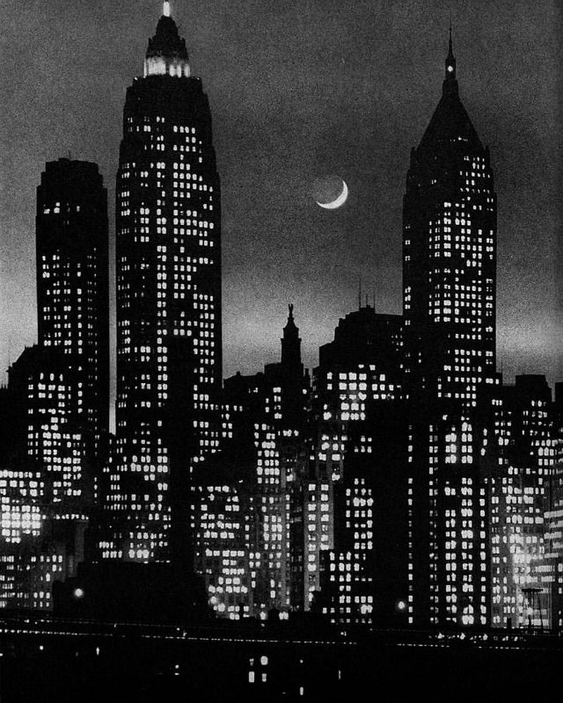 View of a crescent moon over lower Manhattan, 1946. The three tallest buildings are, from left), the City Bank Farmers Trust Building (Cross and Cross, completed 1931; later known as 20 Exchange Place), the Cities Service Building (Clinton & Russell, Holton & George, completed 1932; later known as the American International Building), and the Bank of the Manhattan Company building (H. Craig Severance, completed 1930; later known as 40 Wall Street and the Trump Building).