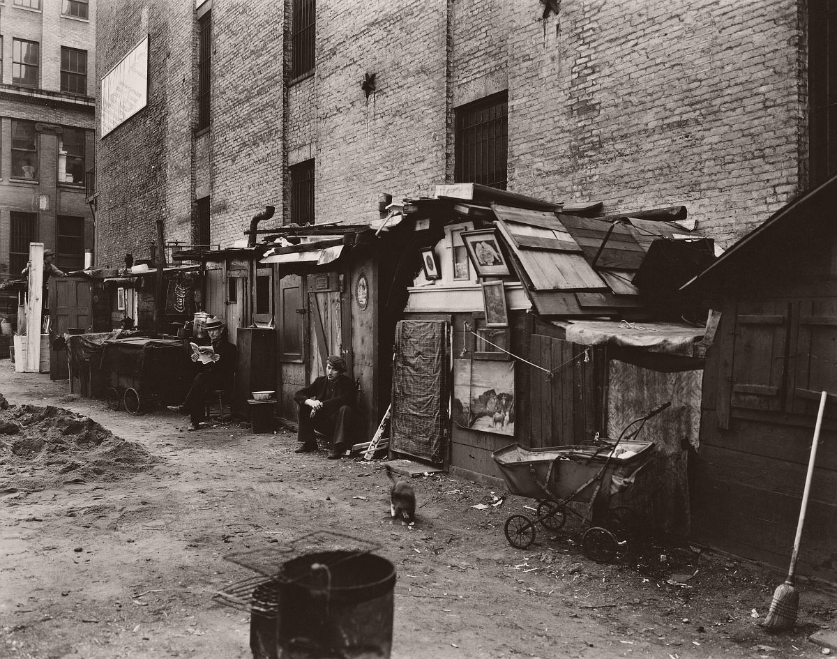Unemployed at their huts in a Hooverville in Manhattan, NYC, West Houston and Mercer Sts.; 1935, Berenice Abbot.