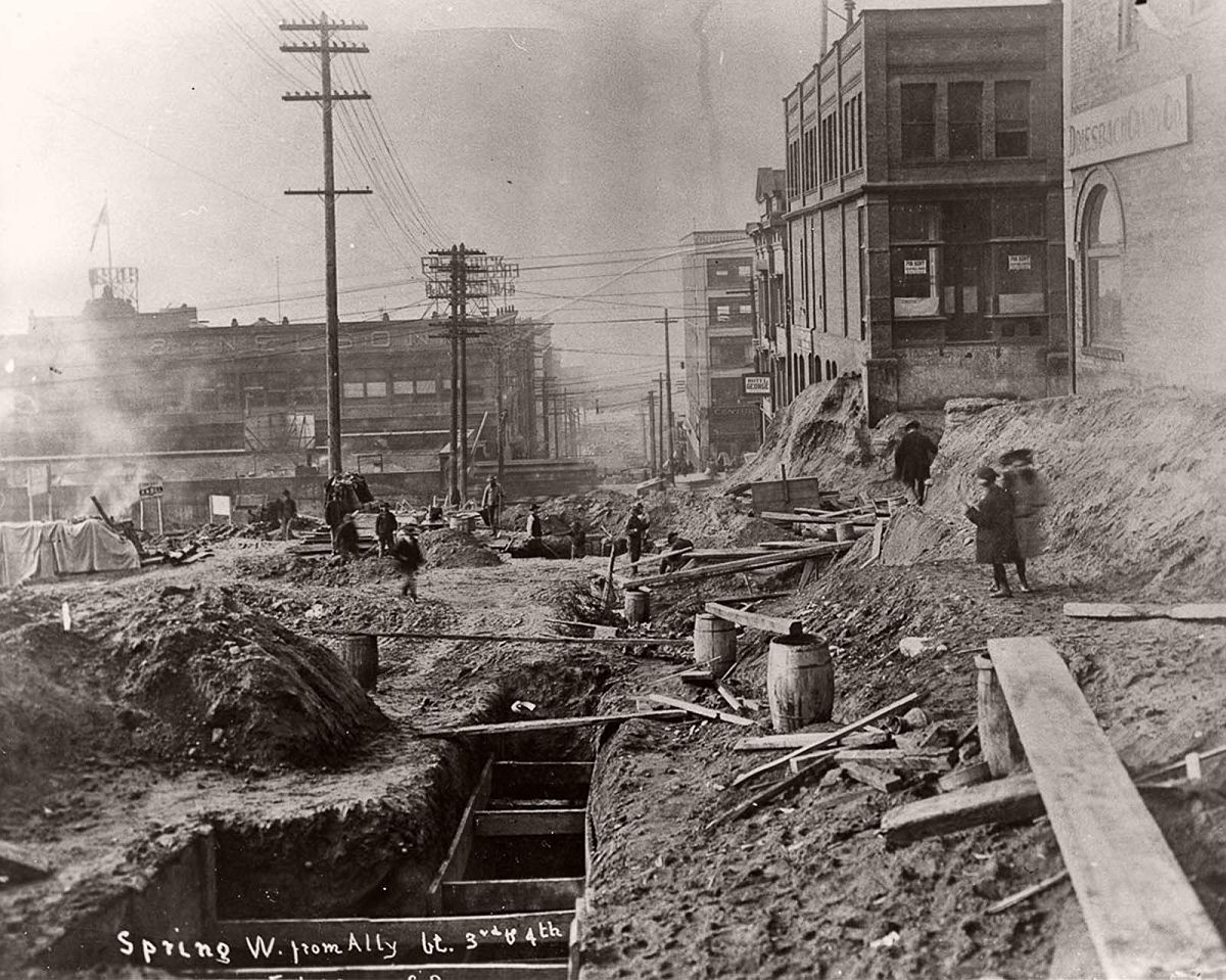 Looking west down Spring Street during the first Denny regrade. 1907.